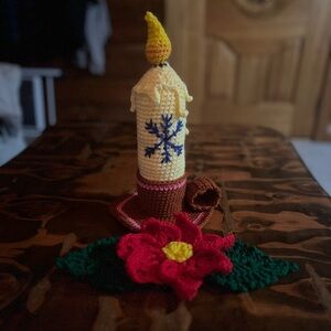 Festive Crochet Candle with Red Flower Accent